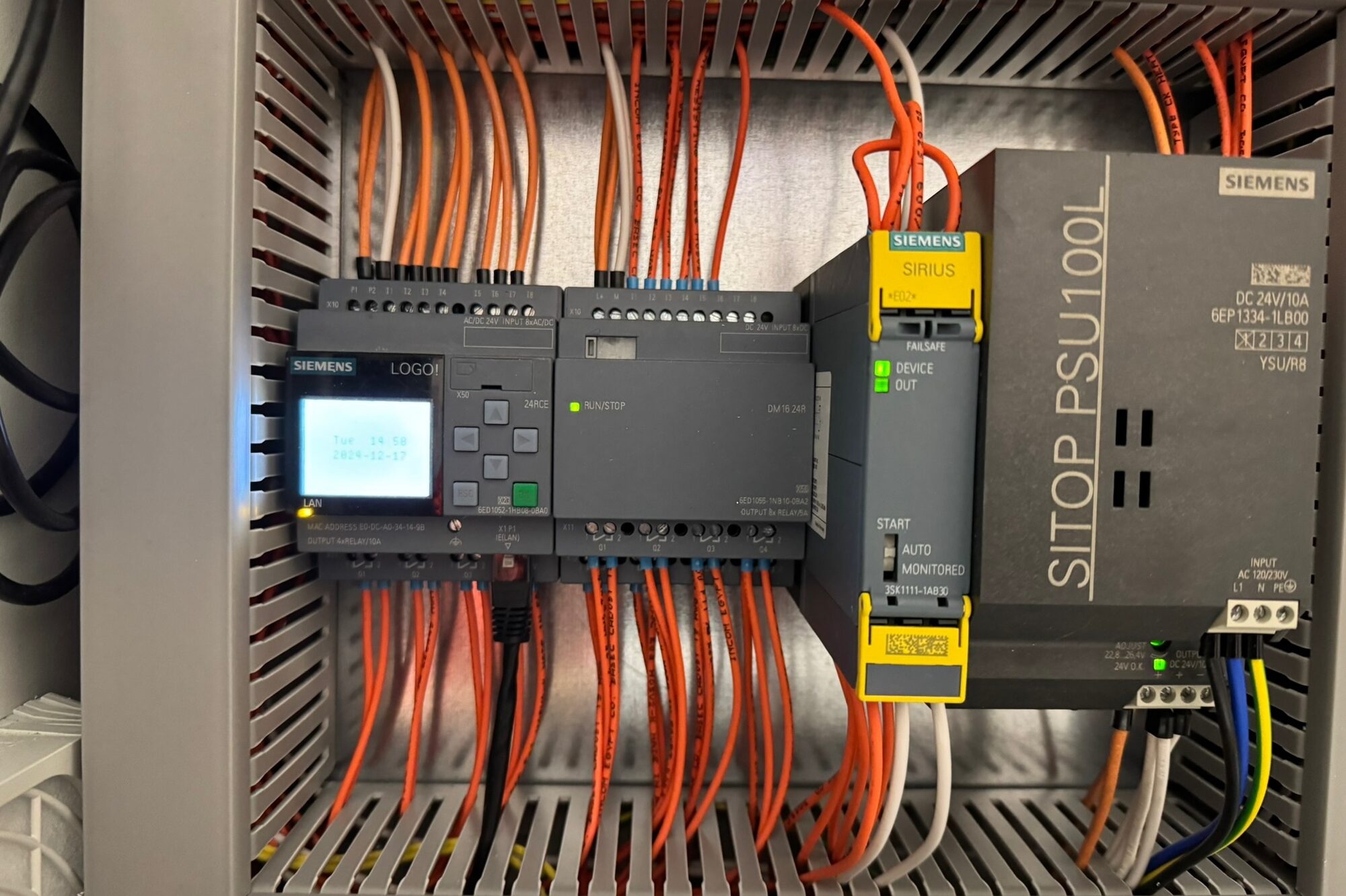 At handover: rebuilt panel — new PLC, neatly loomed wiring
